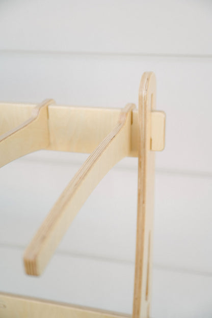 Close-up of a wooden furniture joint, showcasing the interlocking parts and smooth, unfinished wood surface—perfect for those interested in wholesale inquiries for the Surfboard Rack Freestanding by Timber Grooves.